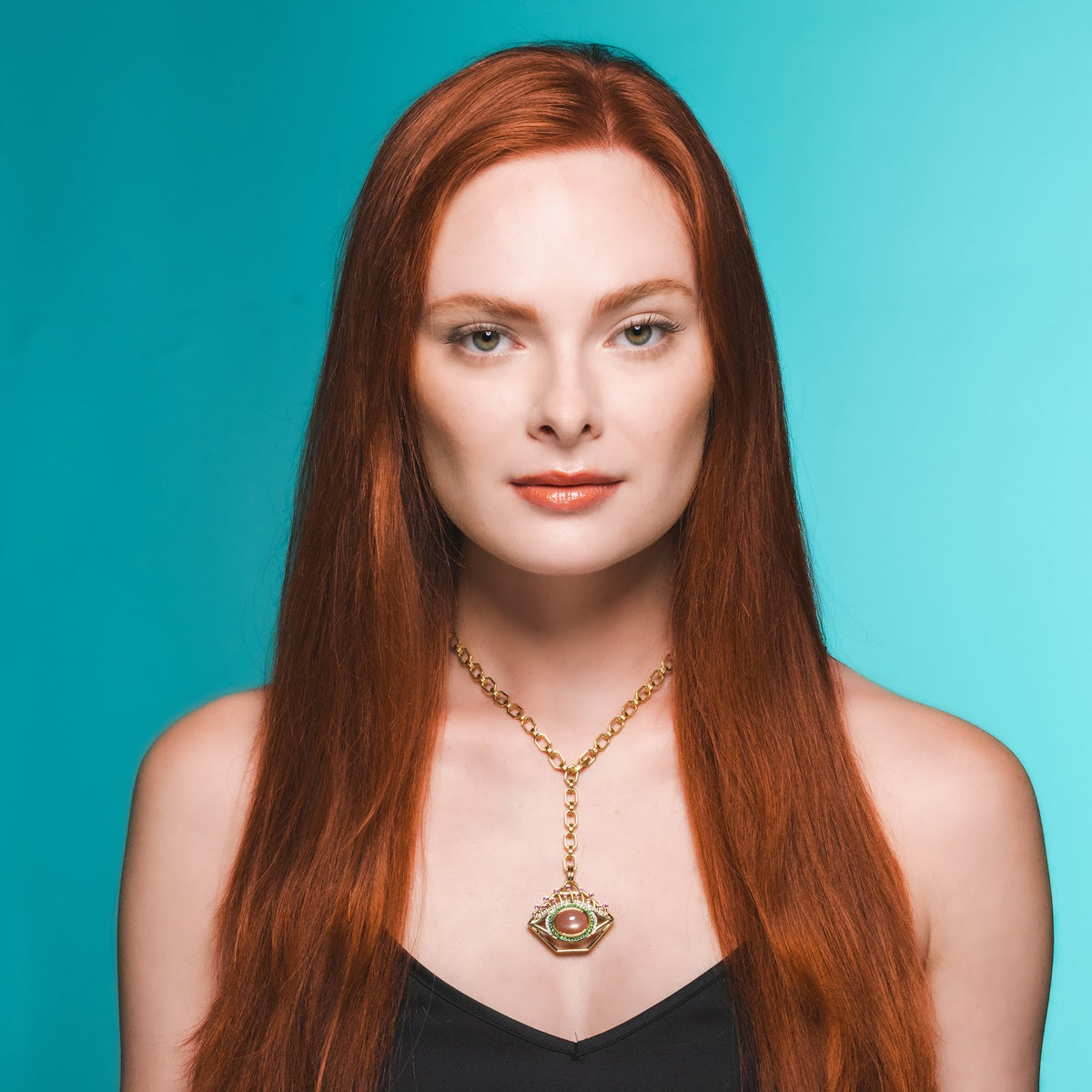 Small Orange Moonstone Eye Pendant on model